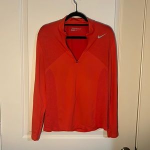 Red dry fit top. Women’s large but fits like a unisex small would.